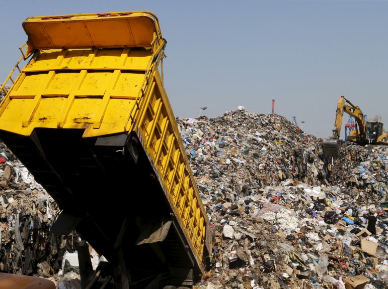 Garbage trucks full of clothes are burned or dumped in a landfill. Source: WeForum